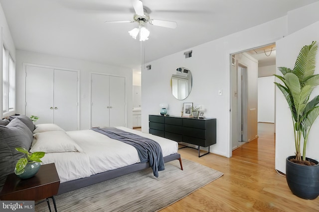 bedroom featuring light wood-style floors and a ceiling fan