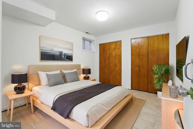 bedroom featuring multiple closets