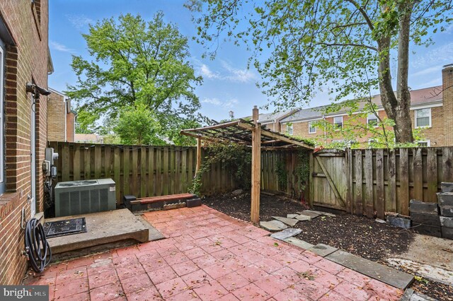 view of patio / terrace featuring cooling unit and a fenced backyard