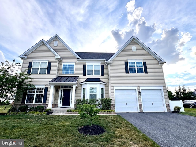 308 Galloway St, Middletown, DE 19709 - view of front of property featuring stone siding, driveway, a front yard, and a garage