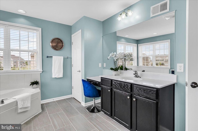 308 Galloway St, Middletown, DE 19709 - full bath with baseboards, healthy amount of natural light, a bath, and vanity