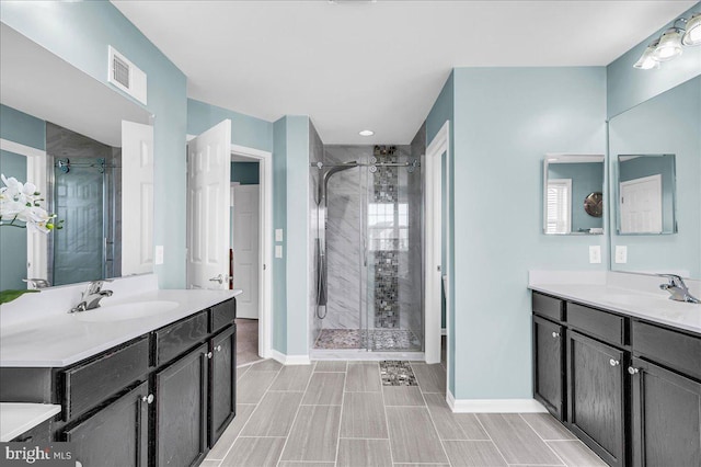 308 Galloway St, Middletown, DE 19709 - full bathroom with baseboards, a stall shower, and two vanities