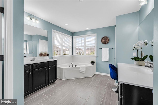 308 Galloway St, Middletown, DE 19709 - full bath featuring a garden tub, two vanities, and baseboards