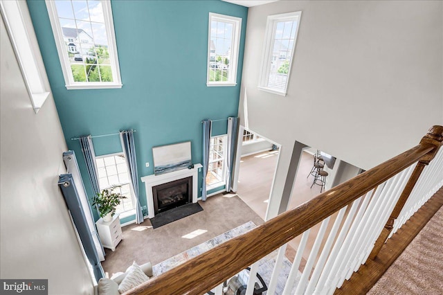 308 Galloway St, Middletown, DE 19709 - staircase with a towering ceiling, plenty of natural light, a fireplace with flush hearth, and baseboards