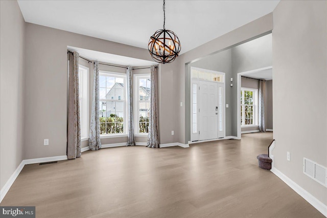 308 Galloway St, Middletown, DE 19709 - entrance foyer with wood finished floors, a chandelier, and baseboards