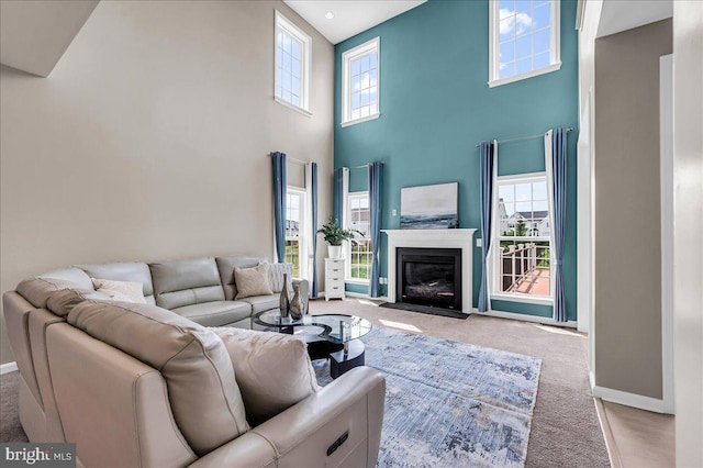 308 Galloway St, Middletown, DE 19709 - living room with a towering ceiling, carpet, baseboards, and a fireplace with flush hearth