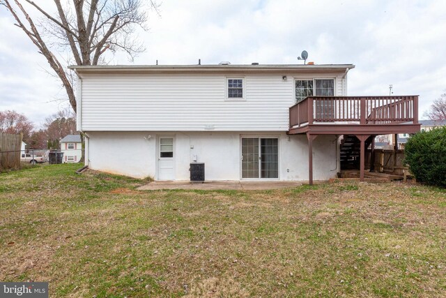rear view of house featuring a deck, central AC unit, stucco siding, and stairway