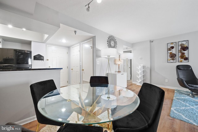 2400 Clarendon Blvd Unit 916, Arlington, VA 22201 - dining area featuring baseboards and light wood-style flooring