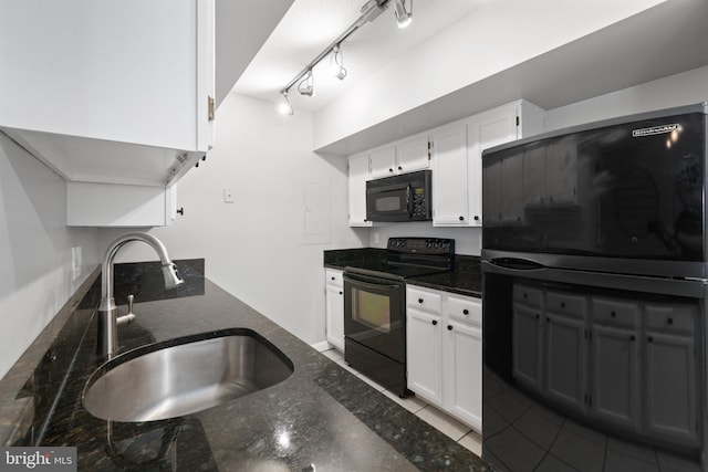 2400 Clarendon Blvd Unit 916, Arlington, VA 22201 - kitchen with black appliances, dark stone countertops, white cabinets, and tile patterned floors