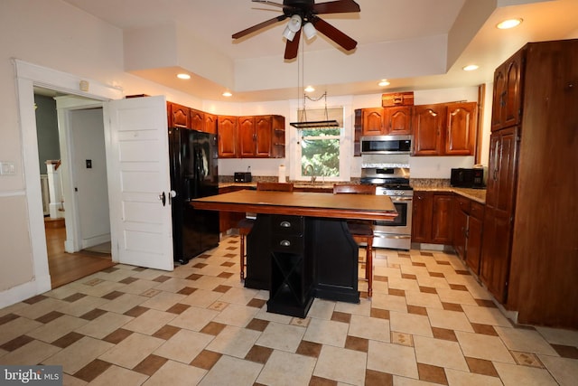 kitchen with black appliances, a sink, ceiling fan, open shelves, and a kitchen island