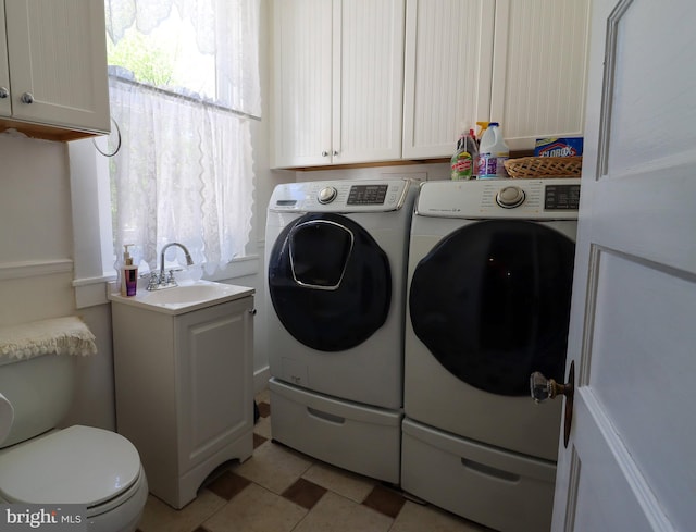 laundry area with separate washer and dryer