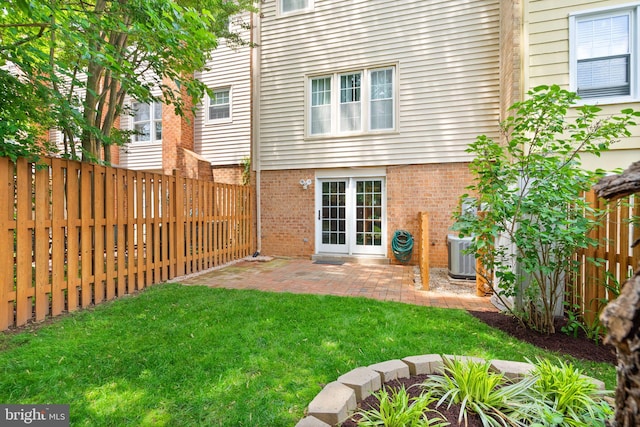 9882 High Water Ct, Burke, VA 22015 - rear view of house featuring brick siding, a patio, and central AC