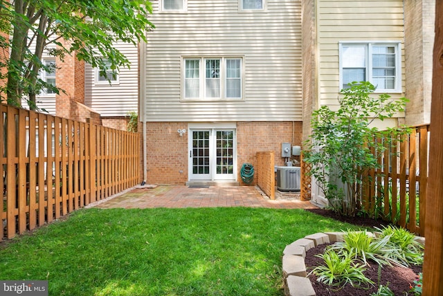 9882 High Water Ct, Burke, VA 22015 - rear view of property with brick siding, central air condition unit, and a patio area