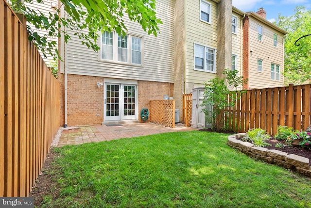 9882 High Water Ct, Burke, VA 22015 - rear view of house featuring brick siding, a patio, and a chimney