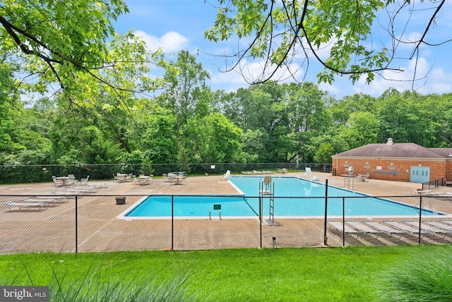 9882 High Water Ct, Burke, VA 22015 - community pool featuring a patio area and a view of trees