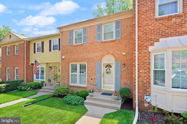 9882 High Water Ct, Burke, VA 22015 - view of property featuring brick siding and a front yard