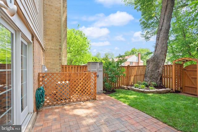 9882 High Water Ct, Burke, VA 22015 - fenced backyard with a patio and a gate