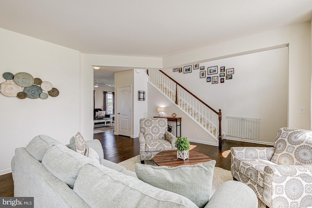 1303 Officers Row, Delaware City, DE 19706 - living room with stairway, dark wood-type flooring, radiator heating unit, and baseboards