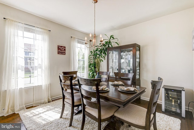 1303 Officers Row, Delaware City, DE 19706 - dining area with a chandelier, wood finished floors, heating unit, and baseboards