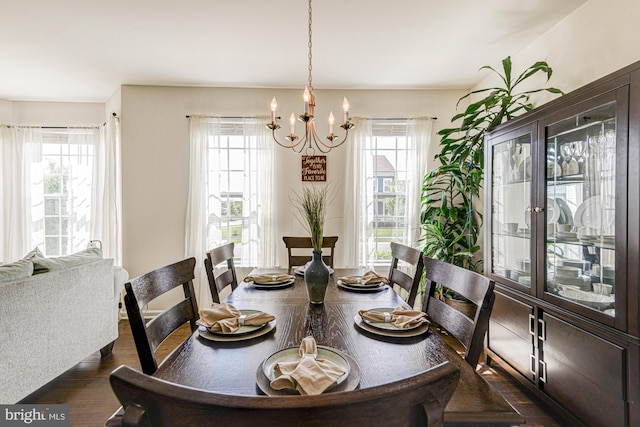 1303 Officers Row, Delaware City, DE 19706 - dining space featuring healthy amount of natural light, a chandelier, and dark wood-style floors