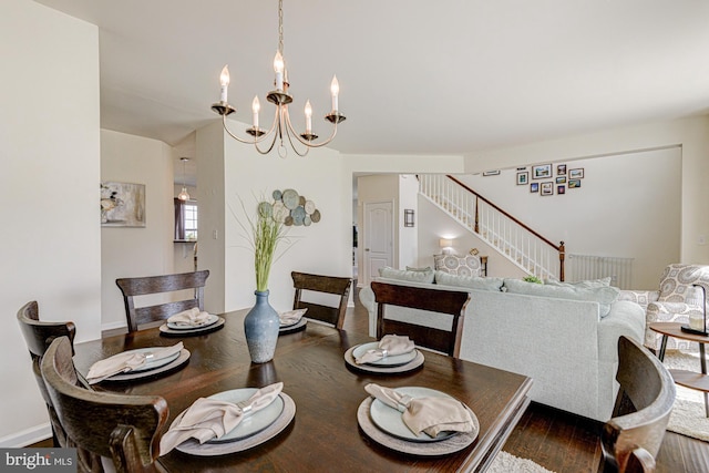 1303 Officers Row, Delaware City, DE 19706 - dining space featuring a chandelier, stairway, and wood finished floors