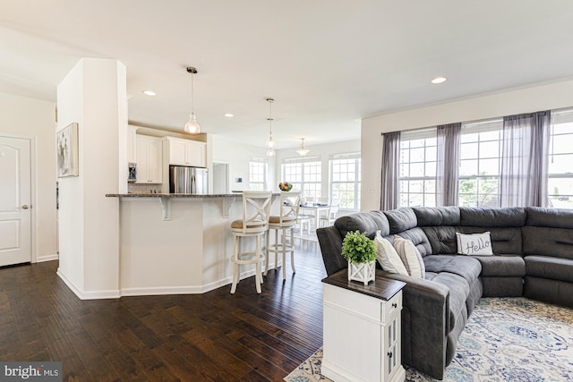 1303 Officers Row, Delaware City, DE 19706 - living room featuring dark wood-style flooring, baseboards, and recessed lighting
