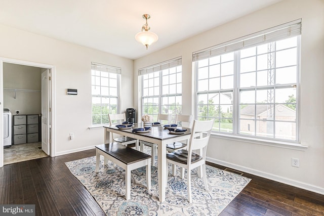 1303 Officers Row, Delaware City, DE 19706 - dining area featuring baseboards, dark wood-style floors, and washer / dryer