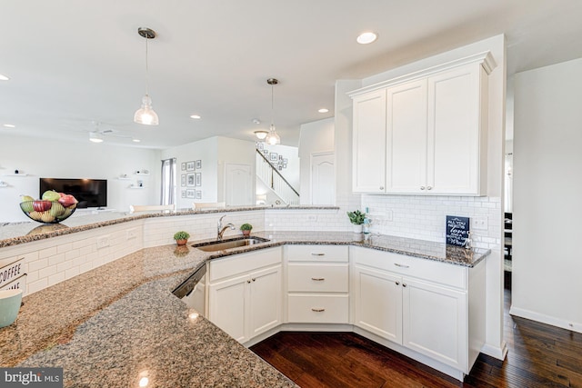 1303 Officers Row, Delaware City, DE 19706 - kitchen with a sink, light stone countertops, dark wood-type flooring, tasteful backsplash, and recessed lighting