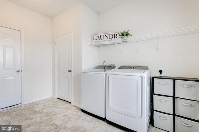 1303 Officers Row, Delaware City, DE 19706 - laundry room featuring washer and clothes dryer and baseboards