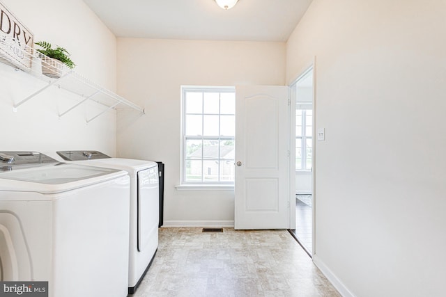 1303 Officers Row, Delaware City, DE 19706 - washroom with washer and clothes dryer and baseboards