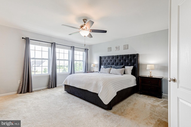 1303 Officers Row, Delaware City, DE 19706 - bedroom with light colored carpet, baseboards, and ceiling fan
