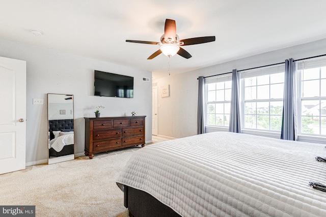 1303 Officers Row, Delaware City, DE 19706 - bedroom featuring light colored carpet, a ceiling fan, and baseboards