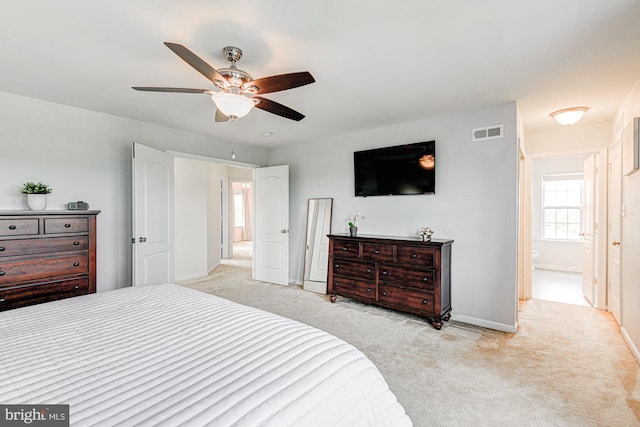 1303 Officers Row, Delaware City, DE 19706 - bedroom with light colored carpet, baseboards, and a ceiling fan