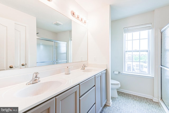 1303 Officers Row, Delaware City, DE 19706 - bathroom featuring baseboards, double vanity, a shower stall, toilet, and tile patterned floors