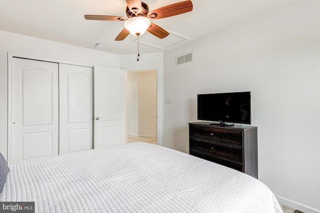 1303 Officers Row, Delaware City, DE 19706 - bedroom featuring a closet, attic access, baseboards, and ceiling fan