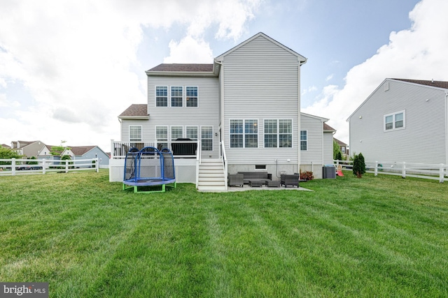1303 Officers Row, Delaware City, DE 19706 - back of house with an outdoor hangout area, a trampoline, cooling unit, and a patio area