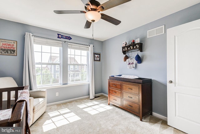 1303 Officers Row, Delaware City, DE 19706 - sitting room with a ceiling fan, baseboards, and light carpet