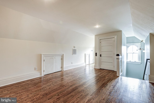 1303 Officers Row, Delaware City, DE 19706 - additional living space with vaulted ceiling, wood finished floors, and baseboards