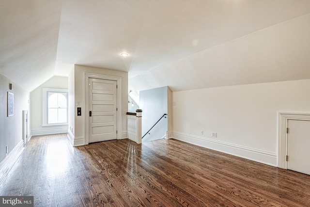1303 Officers Row, Delaware City, DE 19706 - additional living space with vaulted ceiling, wood finished floors, and baseboards