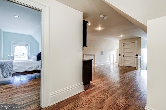 1303 Officers Row, Delaware City, DE 19706 - hallway featuring dark wood-type flooring, baseboards, recessed lighting, and vaulted ceiling
