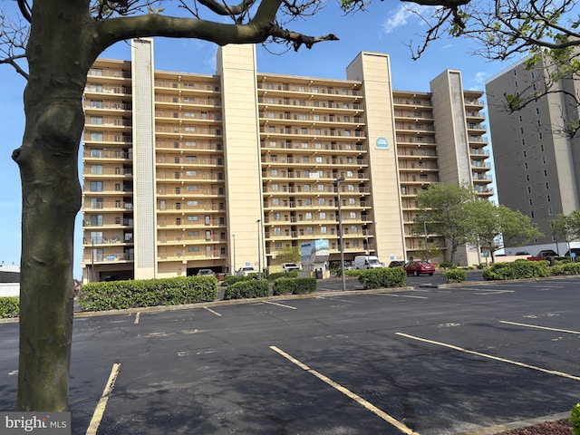 10002 Coastal Hwy Unit 611, Ocean City, MD 21842 - view of apartment building / complex featuring uncovered parking