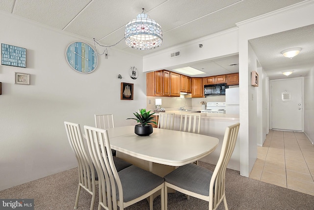 10002 Coastal Hwy Unit 611, Ocean City, MD 21842 - dining area featuring crown molding, a textured ceiling, light tile patterned flooring, and light colored carpet