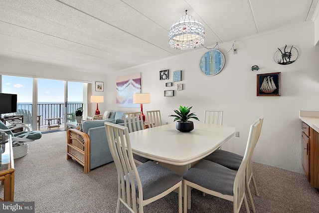 10002 Coastal Hwy Unit 611, Ocean City, MD 21842 - carpeted dining room featuring crown molding and a water view
