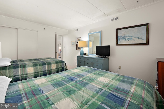10002 Coastal Hwy Unit 611, Ocean City, MD 21842 - bedroom featuring ornamental molding and a closet