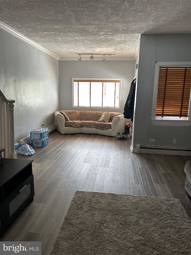 living room with a baseboard radiator, ornamental molding, a textured ceiling, and wood finished floors