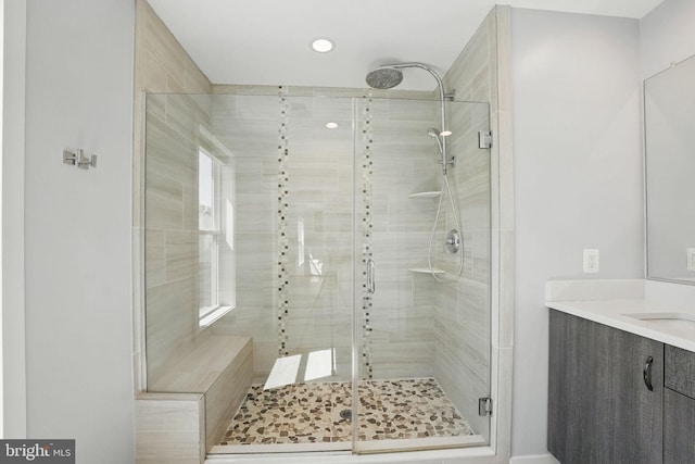 full bathroom with a shower stall, vanity, and recessed lighting