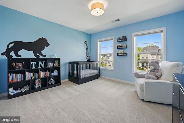 carpeted bedroom with baseboards