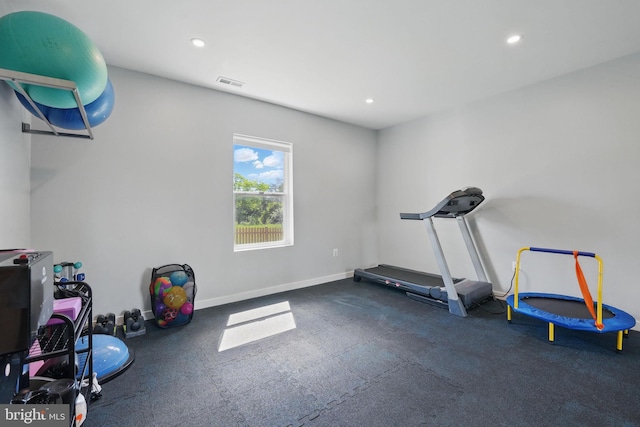 workout room with recessed lighting and baseboards