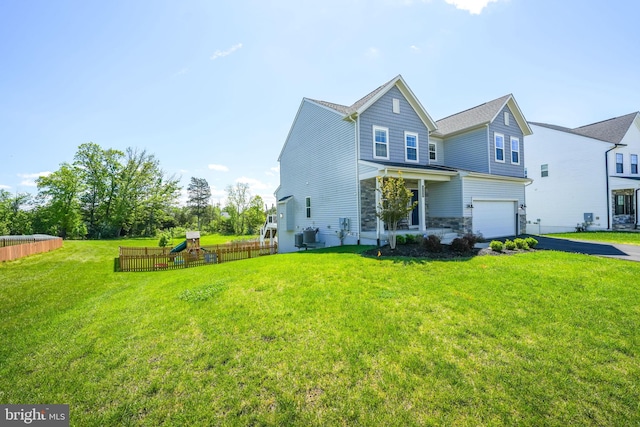 view of front of house featuring a playground, driveway, a garage, and stone siding
