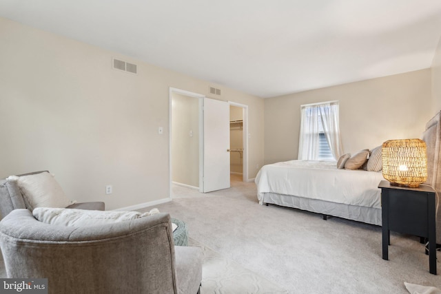 552 Elizabeth Ln, Glen Burnie, MD 21061 - bedroom with light colored carpet, a walk in closet, and baseboards
